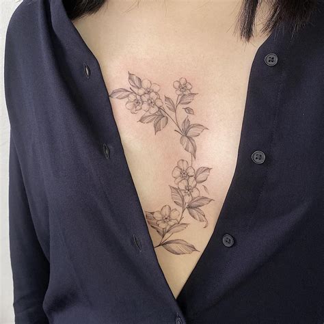 sternum tattoo between breast|Ultimate guide to sternum tattoos: Designs, pain, and。